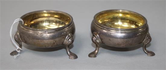 A pair of early George III silver circular salts on hoof feet, London, 1761.